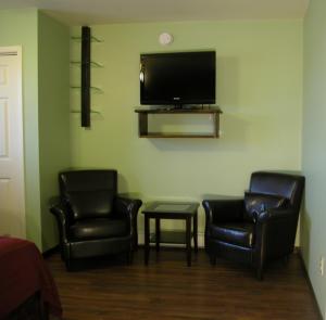 
a living room filled with furniture and a tv at Waterview B&B in Pictou
