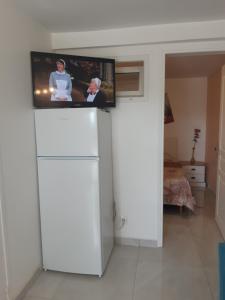 Un televizor și/sau centru de divertisment la Maison au calme 2 Chambre