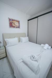 A bed or beds in a room at Maria's Home