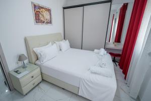 A bed or beds in a room at Maria's Home