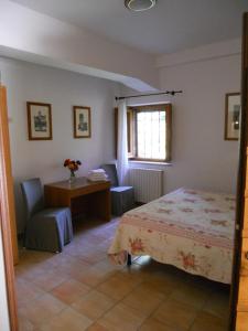 Katil atau katil-katil dalam bilik di Camere La Rugiada