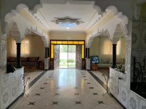 a large room with a lobby with a large door at Charmante villa avec piscine pour famille in Safi