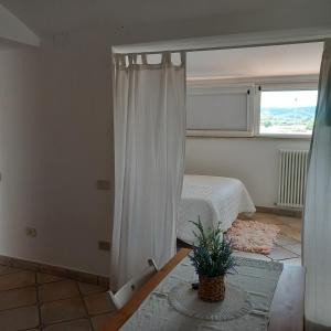 Ένα ή περισσότερα κρεβάτια σε δωμάτιο στο casa vacanza GIOIA