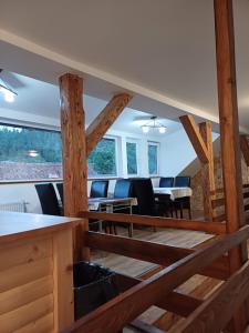 a view of the dining room and living room of a house at Cazare Rasnov in Râşnov +8 photos