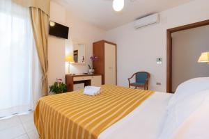 Postel nebo postele na pokoji v ubytování Hotel Galf