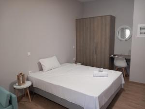 Postel nebo postele na pokoji v ubytování THALASSA ALMYROS APARTMENTS
