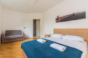 Postel nebo postele na pokoji v ubytování Molo Centrum by Grand Apartments