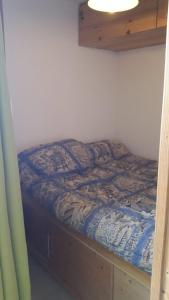 Кровать или кровати в номере Appart Alpe d Huez