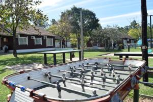 a shuffleboard table with birds on it in a park at Cabañas La Vieja Chacra in Federación