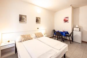Postel nebo postele na pokoji v ubytování Aparthotel Carinzia