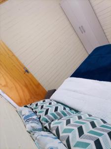 En eller flere senge i et værelse på Cabana Uva Niágara