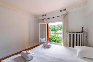 Ένα ή περισσότερα κρεβάτια σε δωμάτιο στο Maison 15 min Aeroport CDG -Parc Asterix - Chantilly