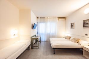 Postel nebo postele na pokoji v ubytování Aparthotel Carinzia