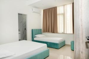 Postel nebo postele na pokoji v ubytování Alv Rent Rooms