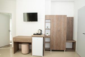 Kuchyň nebo kuchyňský kout v ubytování Alv Rent Rooms