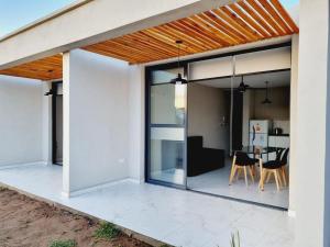 an open living room and dining area of a house at Ayres de Ana in Miramar
