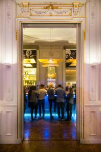 a group of people standing in front of a mirror at Hotel C2 in Marseille