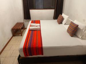 Llit o llits en una habitació de Quipu Hostal