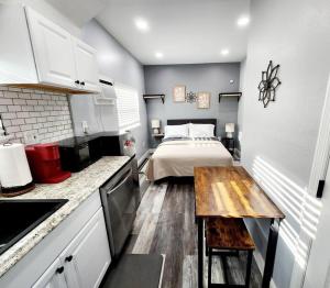 a small kitchen with a bed in a room at Green Roof House Studio in Lakeland