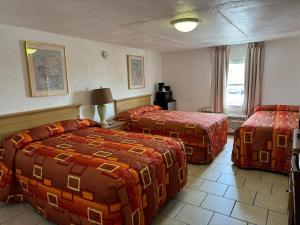 Postel nebo postele na pokoji v ubytování El Ray Motel + 37 fotografií