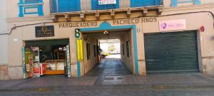 a building with a garage door in a street at Lloresa in Cuenca