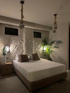 Postel nebo postele na pokoji v ubytování HOTEL BALI AT POBLADO