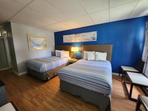 Postel nebo postele na pokoji v ubytování Lido Motel Lake George + 37 fotografií