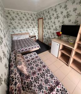 Letto o letti in una camera di Podsolnukhi Guest House
