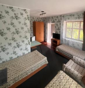 Letto o letti in una camera di Podsolnukhi Guest House