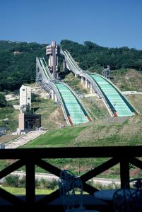 a large bridge on top of a hill at Hakuba Yamano Hotel in Hakuba