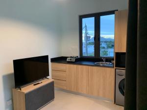 a living room with a flat screen tv and a sink at LuxNar FF Sea in La Gaulette +10 photos