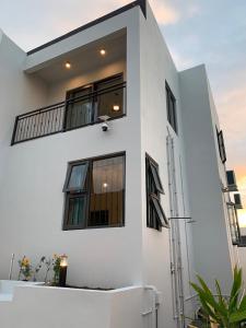 a white building with windows and a balcony at LuxNar FF Sea in La Gaulette