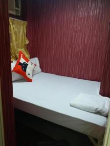 Voodi või voodid majutusasutuse Happy Land Inn 6 F toas