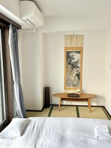 Katil atau katil-katil dalam bilik di 大人気黒門市場徒歩1分 日本橋駅徒歩2分 道顿堀 難波 心斎橋徒歩圏内 金悦マンション