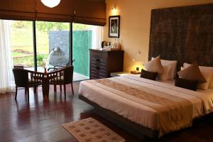 Postel nebo postele na pokoji v ubytování Sigiriya King's Resort