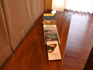 a book sitting on top of a wooden floor at Sigiriya King's Resort in Sigiriya