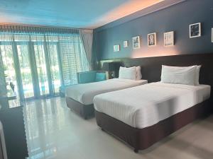 Postel nebo postele na pokoji v ubytování The Bihai Hua Hin