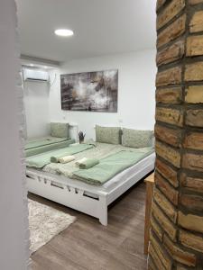 Postel nebo postele na pokoji v ubytování Guest House LILA