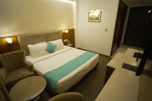 Postel nebo postele na pokoji v ubytování Hotel Krinoscco