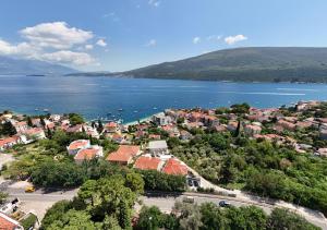 an aerial view of a town next to a body of water at Village Gals in Đenovići