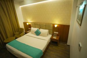Postel nebo postele na pokoji v ubytování Hotel Krinoscco