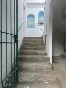 a staircase leading up to a building with a window at B&B Mariagrazia in Albori