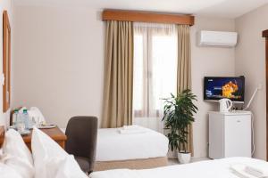 Телевизор и/или развлекательный центр в Homelike Guest house