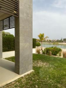 a building with a view of a body of water at Stella Salalah in Salalah