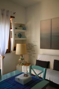 Un pat sau paturi într-o cameră la Appartamento vista mare