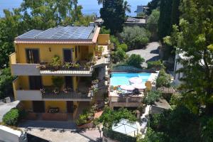 an aerial view of a house with solar panels on the roof at Residence Villa Il Glicine in Taormina