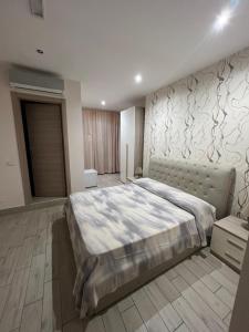 a large bedroom with a large bed in it at La Suite in Cassino +22 photos