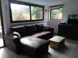 a living room with a couch and a coffee table at Gîte G2735 in Saint-Maximin-la-Sainte-Baume