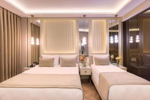 Ένα ή περισσότερα κρεβάτια σε δωμάτιο στο Great Fortune Concept Hotel +33 φωτογραφίες