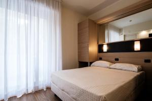 Augustus Hotel Riccione客房内的一张或多张床位